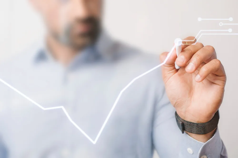 Hand drawing a rising growth line